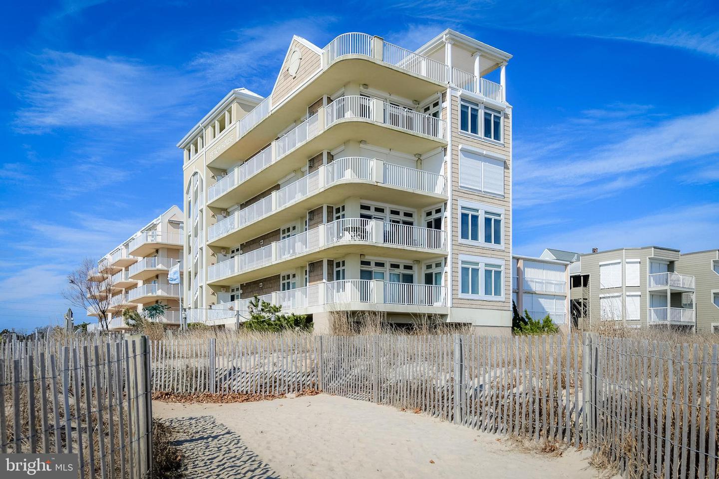 view from beach dunes of multi floored vacation rental condos